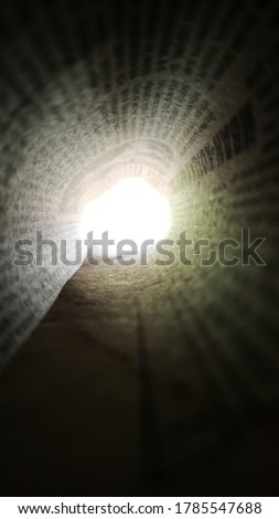 Photo view through a rolled up newspaper.  Wallpapers for phone or social networks