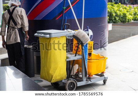 man worker  working with janitorial, cleaning equipment and tools for floor cleaning interior building.