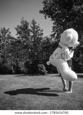 Black and white holding bear picture 

