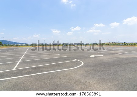 Empty parking lot with blue skies