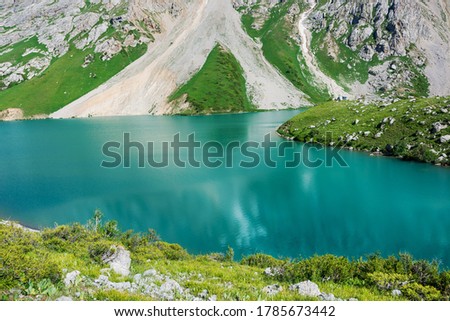 Beautiful mountain turquoise color lake Colculan in Tian-Shan, Kyrgyzstan.