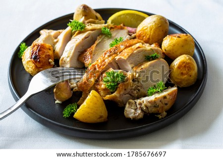 Greek Style Roasted Chicken, Potatoes, Parsely and Lemon Royalty-Free Stock Photo #1785676697