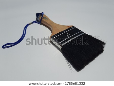 Chapang, painted black hair, wooden handle, rope tied at the end of the handle
