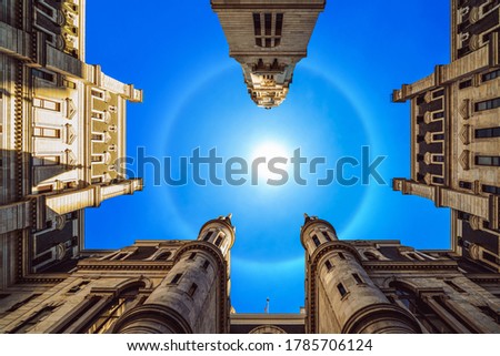 Uprisen angle of Philadelphia city hall with historic building over blue sky with corona sun, Pennsylvania, USA or United States of America, Architecture and building, Travel and Tourism concept
