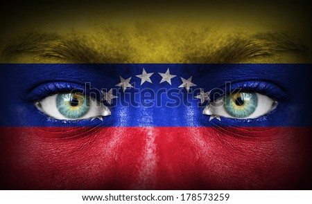 Human face painted with flag of Venezuela