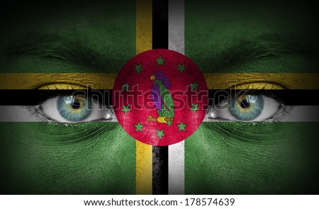 Human face painted with flag of Dominica