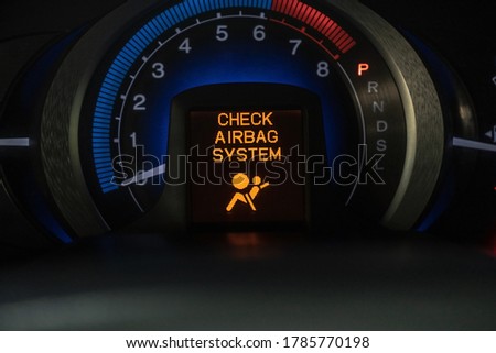 check airbag system warning icon on vehicle dashboard, car computer display Royalty-Free Stock Photo #1785770198