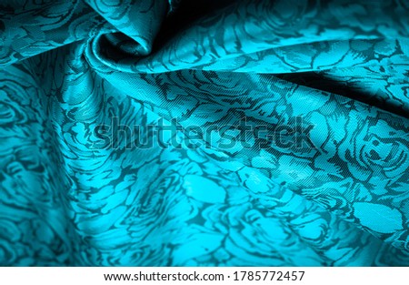 relief pattern, composite textiles, blue silk fabric with a floral pattern, unusually pleasant visual sensations: slippery, coolness, softness; beautiful appearance, unique shine;