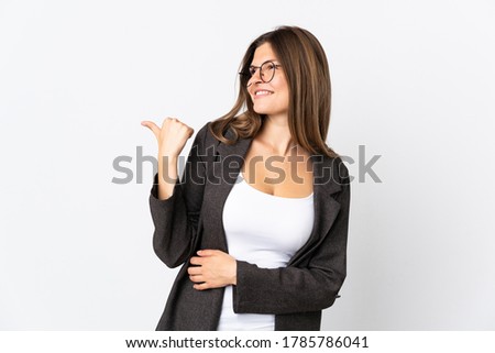 Business slovak woman isolated on white background pointing to the side to present a product