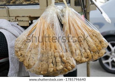 Selective focus picture of "lokcing" or Kelantanese satay fish pack in plastic bag before been cook.