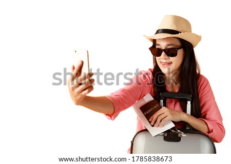 Beautiful asian woman cheerful smiling and take selfie on smart mobile phone, beauty young girl wear hat enjoy and fun in vacation isolated on white background, holiday concept. 