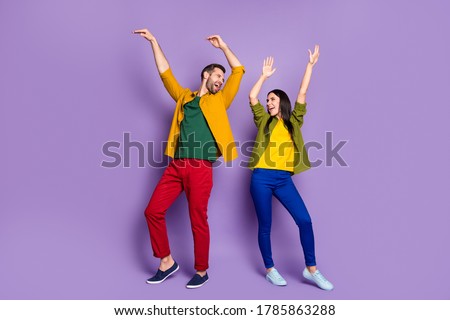 Private party. Full length photo of pretty lady handsome guy chilling home quarantine rejoicing listen music dancing happy together wear shirts pants shoes isolated purple color background