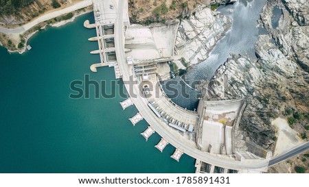 Hydroelectric power energy plant with turbines and water spills for generating green electricity. Free, green adn ecological energy concept. Climate changes Royalty-Free Stock Photo #1785891431