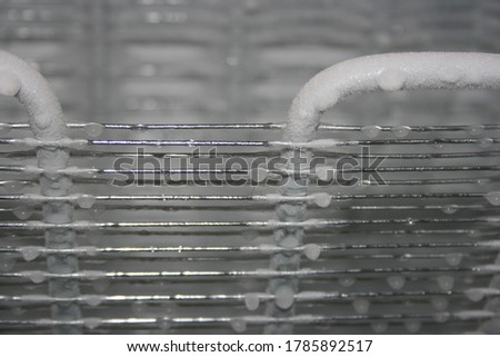 a picture of cold freezer with ice