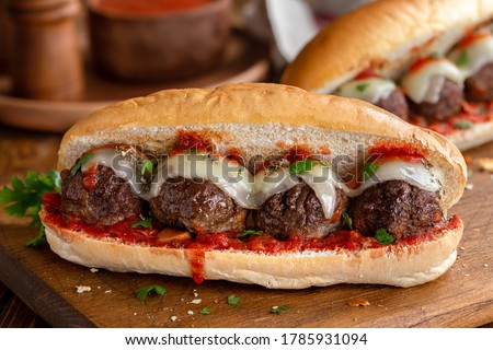 Meatball sandwich with tomato sauce and cheese on a hoagie roll Royalty-Free Stock Photo #1785931094