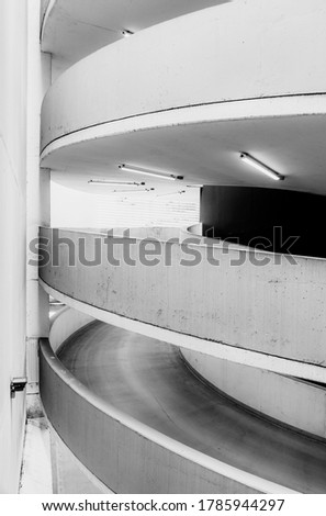 Empty underground garage interior with concrete walls and floor