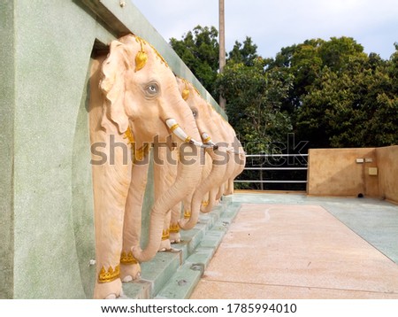 Elephant statues on cement walls