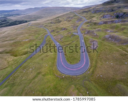 An aerial view of the A4069 known as the Black Mountain Pass in South Wales UK often used in a popular TV car series because of the fast winding roads Royalty-Free Stock Photo #1785997085