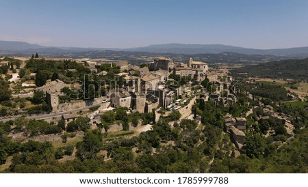 Panoramic Drone view of Gordes France and it's old town from an aerial point of view in the format of a panoramic landscape