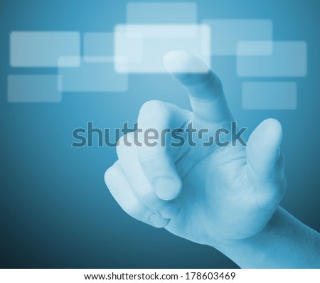 hand pushing a button on a touch screen interface 