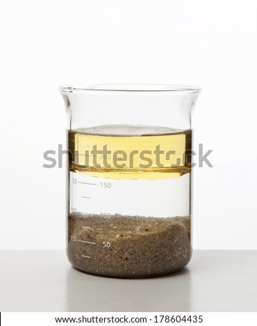 heterogeneous mixture - water, oil and sand. Royalty-Free Stock Photo #178604435