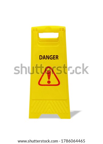 "DANGER" sign black text and red triangle and exclamation mark icon on the yellow object. Warning sign on the floor isolated on white background with shadow and clipping path.