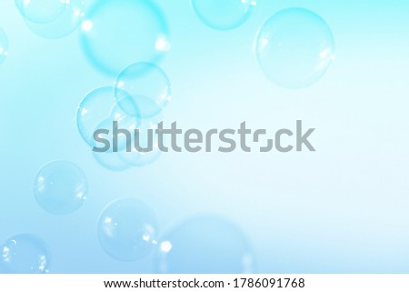 Blue soap bubbles with copy space background.