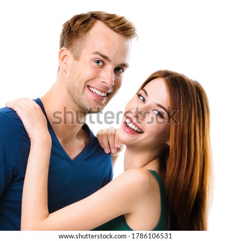 Smiling attractive young amorous couple. Square composition portrait image of embracing models at happy in love studio concept, isolated over white background. Man and woman posing together. 