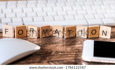 Letters on wooden pieces concept, business background with the french word "formation" means training Royalty-Free Stock Photo #1786122587
