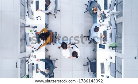 Top Down Shot of Big Busy Corporate Office with Tow Rows off Businessmen and Businesswomen Working on Desktop Computers. Bright Open Space Office with Businesspeople and Salespeople Royalty-Free Stock Photo #1786143092