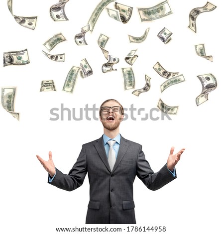 One fun businessman or office worker exults and shout with rain from money, on white background . Triumphing and winner concept.