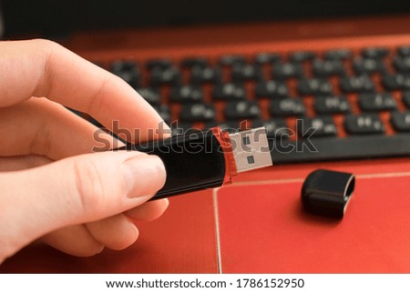 Usb flash drive in hand close up