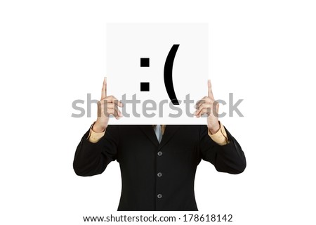 Businessman hold board with sad face emoticon isolated on white background