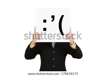 Businessman hold board with cry face emoticon isolated on white background