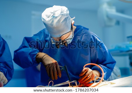 Surgery operation. Surgeon in operating room with robotic surgery equipment. Medical background, selective focus. Royalty-Free Stock Photo #1786207034