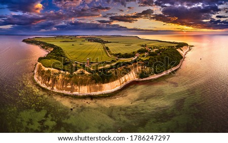 drone view of lighthouses in sunset from northern part of island of Ruegen - called Kap Arkona Royalty-Free Stock Photo #1786247297