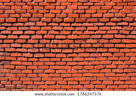 Red painted miniature brick for background or desktop wallpaper