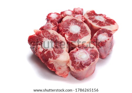 Fresh uncooked ox tail portions on white background. Meat industry product. Royalty-Free Stock Photo #1786265156