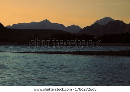                     sunset in the mountains near the mountain river           