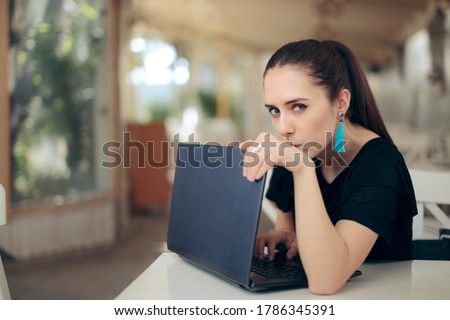 Woman with Laptop Worried About Online Privacy of Personal Data. Girl trying to keep her internet data confidential typing password in secret
 Royalty-Free Stock Photo #1786345391