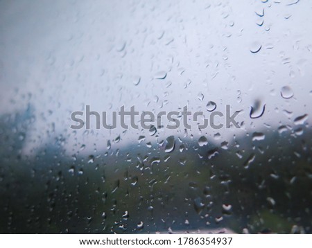 fogged glass and drops from inside with mountain view