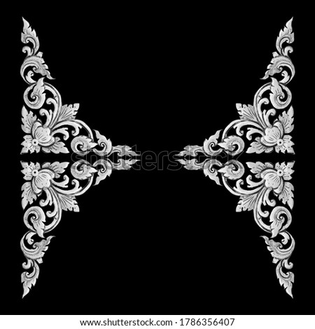 Pattern of flower carved silver frame isolated on black background