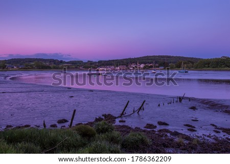 Twilight over the River Dee estuary at low tide at Kirkcudbright Harbour, Galloway, southern Scotland.