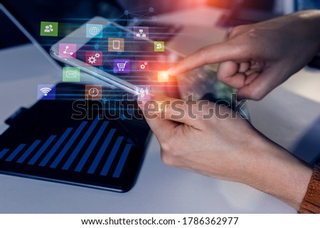 Double exposure of businesswoman working and business financial virtual chart, Digital network marketing concept, Background toned image blurred.