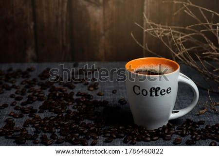 white coffee mugs and coffee beans on flooor