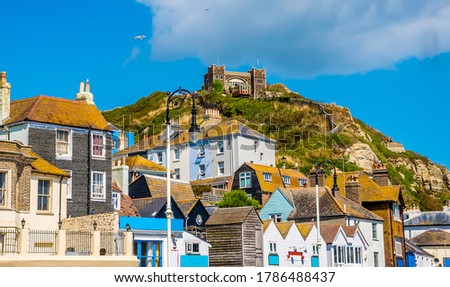 The unique and individual buildings of Hastings old town dominated by the east cliff and funicular railway in summer Royalty-Free Stock Photo #1786488437