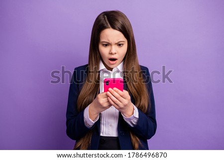 Portrait of her she small little dissatisfied long-haired girl using gadget browsing reading negative comment feedback communicate isolated bright vivid shine vibrant lilac violet color background