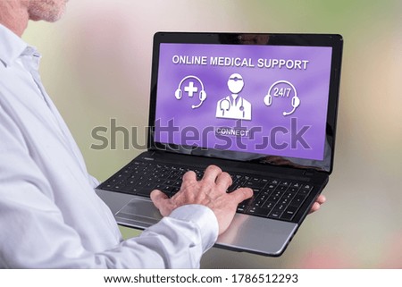 Man using a laptop with online medical support concept on the screen