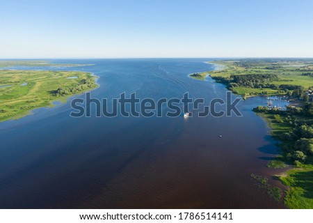 Panoramic aerial view of the Volkhov River and Lake Ilmen near Veliky Novgorod, natural attractions of Russia. Royalty-Free Stock Photo #1786514141