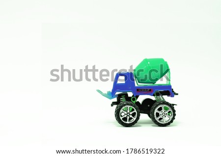 colorful truck cement (concrete) mixer plastic toy isolated on white background
